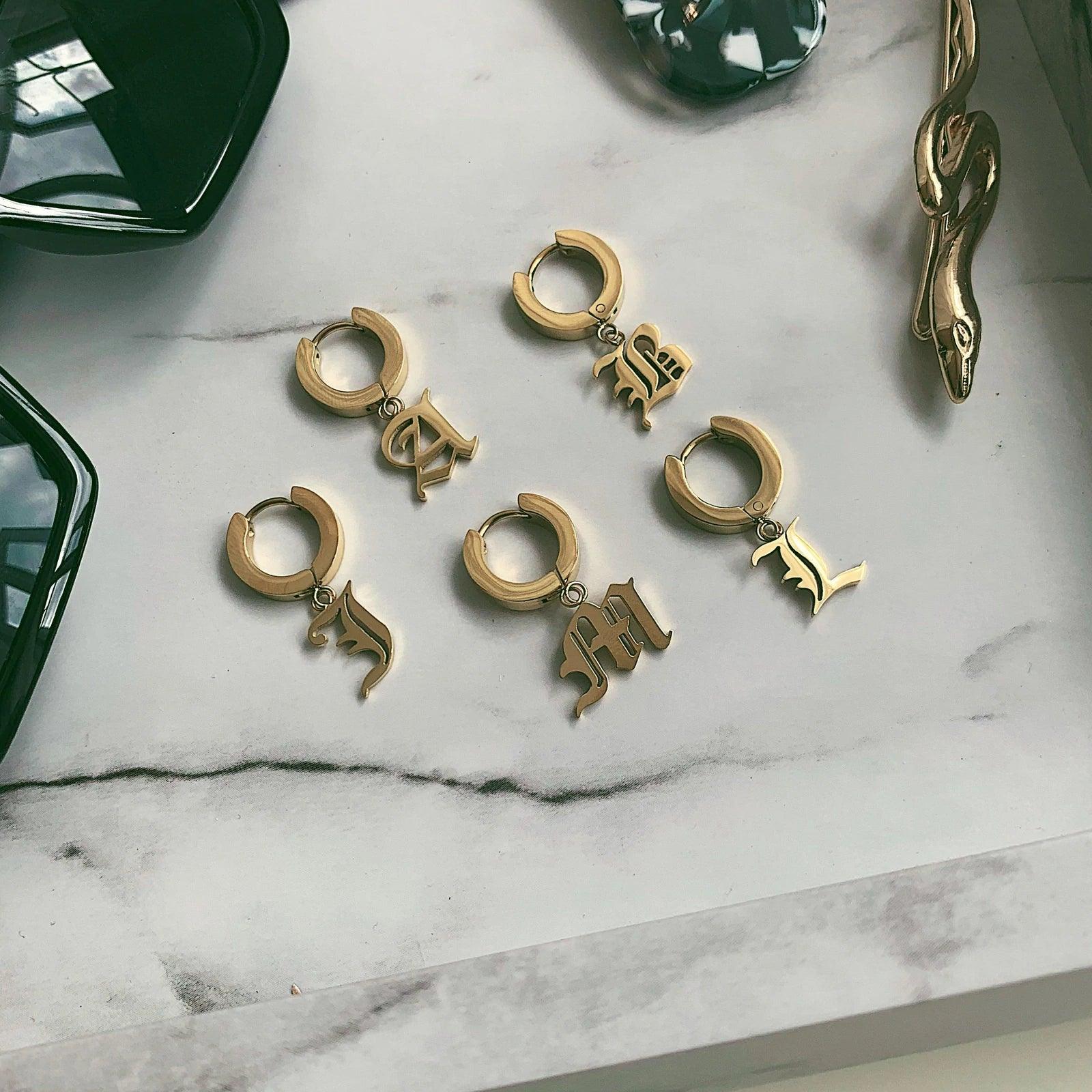 Old English Huggie Earrings - Camillaboutiqueco camillaboutiqueshop.com